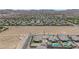 Desert property surrounded by similarly built homes in a desert neighborhood at 7258 W Le Baron Ave, Las Vegas, NV 89178