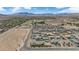 Desert community view featuring desert landscape, mountains and many single-Gathering homes at 7258 W Le Baron Ave, Las Vegas, NV 89178