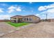 This backyard provides outdoor living space, gravel, and a covered patio at 7258 W Le Baron Ave, Las Vegas, NV 89178