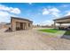 Low maintenance backyard offers a mix of gravel and artificial turf at 7258 W Le Baron Ave, Las Vegas, NV 89178
