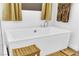 Close-up of a modern white bathtub with chrome fixtures, a wood stool, and a bamboo mat at 7258 W Le Baron Ave, Las Vegas, NV 89178
