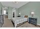 The bedroom has great natural light, black furniture, and an attached closet at 7258 W Le Baron Ave, Las Vegas, NV 89178