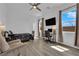 Cozy bedroom with natural light, ceiling fan, and desk space at 7258 W Le Baron Ave, Las Vegas, NV 89178
