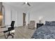 Bright bedroom with light color walls, ceiling fan, and neutral decor at 7258 W Le Baron Ave, Las Vegas, NV 89178