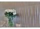 Close up shot of vase with flowers against textured wall at 7258 W Le Baron Ave, Las Vegas, NV 89178