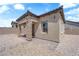 A charming exterior featuring stone accents, a welcoming entrance, and desert landscaping at 7258 W Le Baron Ave, Las Vegas, NV 89178