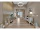 Elegant foyer with decorative wall panel, stylish decor and gleaming floors at 7258 W Le Baron Ave, Las Vegas, NV 89178