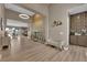 Open foyer showcases a modern chandelier, textured accent wall, and stylish decor at 7258 W Le Baron Ave, Las Vegas, NV 89178