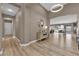 Bright foyer with hardwood flooring and views into the living and dining areas at 7258 W Le Baron Ave, Las Vegas, NV 89178