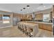 Open kitchen featuring a granite island with seating and stainless steel appliances at 7258 W Le Baron Ave, Las Vegas, NV 89178