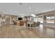 Large, open-concept space combining living, dining, and sitting areas, with hardwood floors and seamless transitions at 7258 W Le Baron Ave, Las Vegas, NV 89178