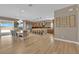 Open-concept dining and kitchen area with a large island, modern appliances, and hardwood floors at 7258 W Le Baron Ave, Las Vegas, NV 89178