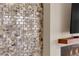 Close-up of stone accent wall with electric fireplace at 7258 W Le Baron Ave, Las Vegas, NV 89178