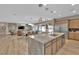 Open-concept living space combines dining, living, and gourmet kitchen area at 7258 W Le Baron Ave, Las Vegas, NV 89178
