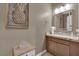 Elegant powder room featuring stylish decor, modern fixtures, and a neutral color scheme at 7258 W Le Baron Ave, Las Vegas, NV 89178