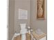 Powder room showcasing decorative art, updated fixtures, and a clean, modern design at 7258 W Le Baron Ave, Las Vegas, NV 89178