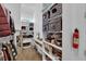 Bright walk-in closet featuring custom shelving, a work desk, and organized storage solutions at 7258 W Le Baron Ave, Las Vegas, NV 89178