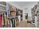 Well-organized walk-in closet offering ample storage, shelving, and seating at 7258 W Le Baron Ave, Las Vegas, NV 89178