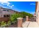 Upstairs balcony overlooking the surrounding area with vibrant green landscaping at 7325 Perkins Hill St, Las Vegas, NV 89166