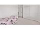 Bedroom with closet, neutral carpet, and bed; a cozy, furnished space at 7325 Perkins Hill St, Las Vegas, NV 89166