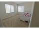 Cozy bedroom with a twin bed, neutral carpet, and bright natural light at 7325 Perkins Hill St, Las Vegas, NV 89166