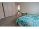 Spacious bedroom showcases carpet, natural light, and a closet at 7325 Perkins Hill St, Las Vegas, NV 89166