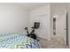 Small bedroom featuring a stationary bike and a walk-in closet at 7325 Perkins Hill St, Las Vegas, NV 89166
