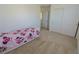 Comfortable bedroom with carpet, closet, and a twin bed at 7325 Perkins Hill St, Las Vegas, NV 89166