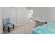 Bedroom with closet, desk, chair, and bed; a cozy, furnished space at 7325 Perkins Hill St, Las Vegas, NV 89166