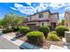 Charming two-story home with a brick driveway, lush landscaping, and a two car garage at 7325 Perkins Hill St, Las Vegas, NV 89166