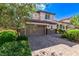 Charming two-story home with a brick driveway and lush landscaping, plus a two car garage at 7325 Perkins Hill St, Las Vegas, NV 89166