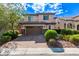 Charming two-story home with a brick driveway and lush landscaping at 7325 Perkins Hill St, Las Vegas, NV 89166