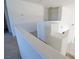 Bright hallway showcases open concept, neutral tones, and smooth carpet at 7325 Perkins Hill St, Las Vegas, NV 89166