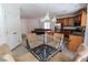 Modern kitchen featuring stainless steel appliances, a table set, and wooden cabinets at 7325 Perkins Hill St, Las Vegas, NV 89166