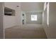 Bright, carpeted living room with high ceilings, neutral walls, and plenty of natural light at 7325 Perkins Hill St, Las Vegas, NV 89166