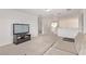 Cozy upstairs living room offering a comfortable seating area and entertainment setup with a TV at 7325 Perkins Hill St, Las Vegas, NV 89166
