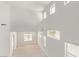 Expansive living area showcasing high ceilings, numerous windows, and abundant natural light throughout at 7325 Perkins Hill St, Las Vegas, NV 89166