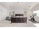 Spacious main bedroom featuring neutral carpet, sitting area, ensuite bath, and dedicated workout area at 7325 Perkins Hill St, Las Vegas, NV 89166