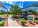 A shaded neighborhood playground featuring various play structures and lush greenery at 7325 Perkins Hill St, Las Vegas, NV 89166