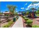 Community playground with shade cover, picnic pavilion, benches, and lush landscaping for Gathering enjoyment at 7325 Perkins Hill St, Las Vegas, NV 89166