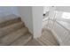 Carpeted staircase with white banister leads to the upper level at 7325 Perkins Hill St, Las Vegas, NV 89166