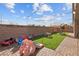Amazing backyard features a playground set, putting green and a brick paver patio at 7616 Quail Dust St, North Las Vegas, NV 89084