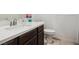 Bathroom with modern fixtures, countertop space, and a toilet at 7616 Quail Dust St, North Las Vegas, NV 89084