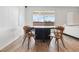 Dining room boasts a modern table and chairs, creating an inviting space for enjoying meals and gatherings at 7616 Quail Dust St, North Las Vegas, NV 89084