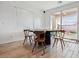 Bright dining area with modern table and chairs, offering a cozy space for meals with a backyard view at 7616 Quail Dust St, North Las Vegas, NV 89084