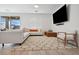 Bright living room features stylish decor, a plush rug, and comfortable seating, perfect for relaxing and entertaining at 7616 Quail Dust St, North Las Vegas, NV 89084