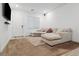 Bright living room features a large sectional couch, neutral tones, and ample natural light at 7616 Quail Dust St, North Las Vegas, NV 89084