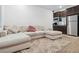 An open living area features recessed lights, a plush sectional, and a small snack bar at 7616 Quail Dust St, North Las Vegas, NV 89084