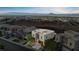 Aerial perspective showcases community homes nestled near desert landscape with city views afar at 778 Horizon Canyon Dr, Henderson, NV 89052