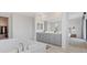 Bathroom featuring soaking tub and gray double vanity at 778 Horizon Canyon Dr, Henderson, NV 89052